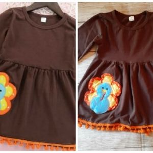 Brown Turkey Dress with orange Tassles.